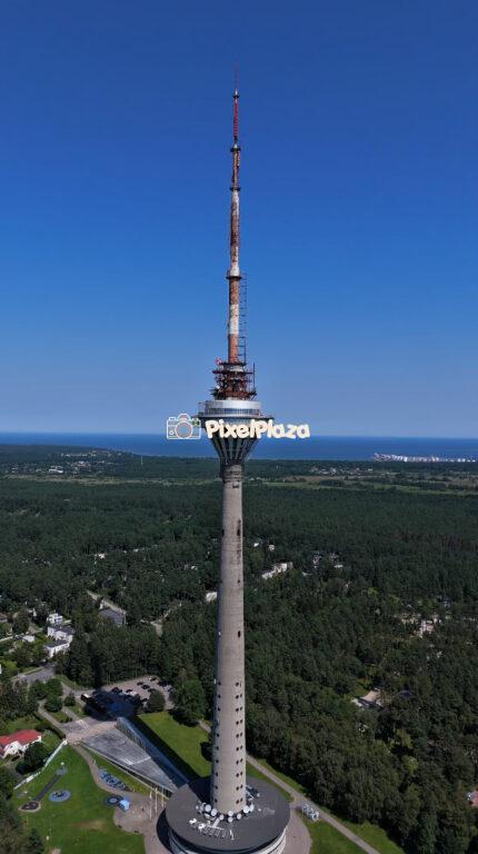Aerial View of Tallinn TV Tower - Iconic Landmark of Estonia with Baltic Sea Horizon 4K Drone Video